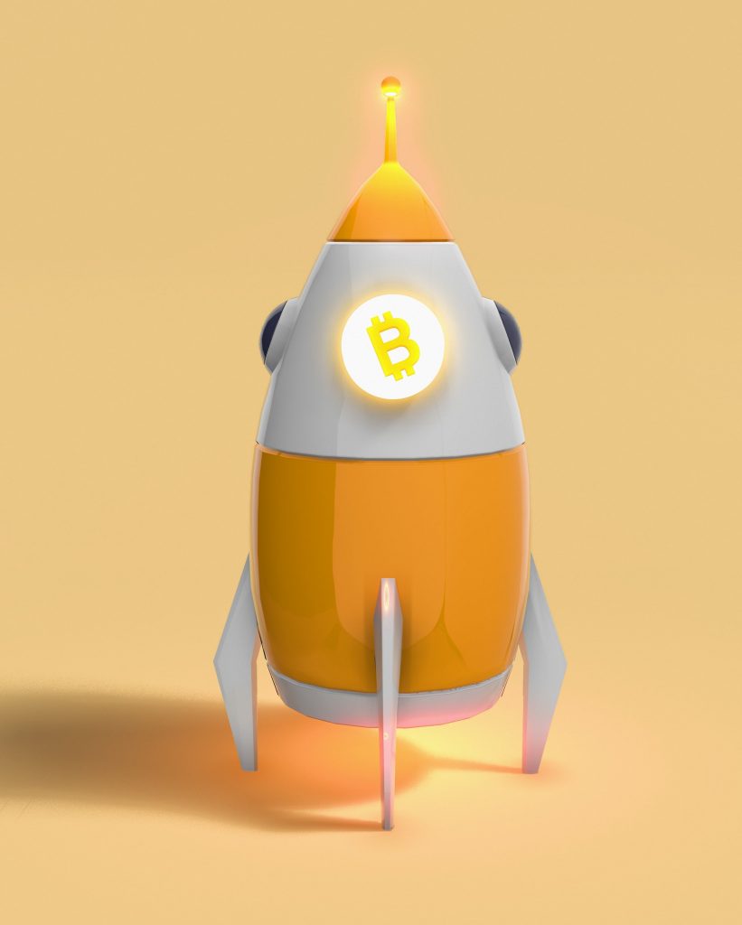 bitcoin symbol on a rocket