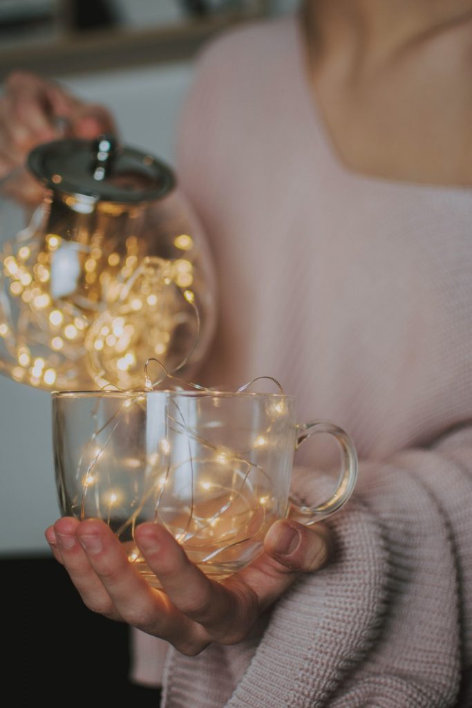 fairy lights being poured into a cup