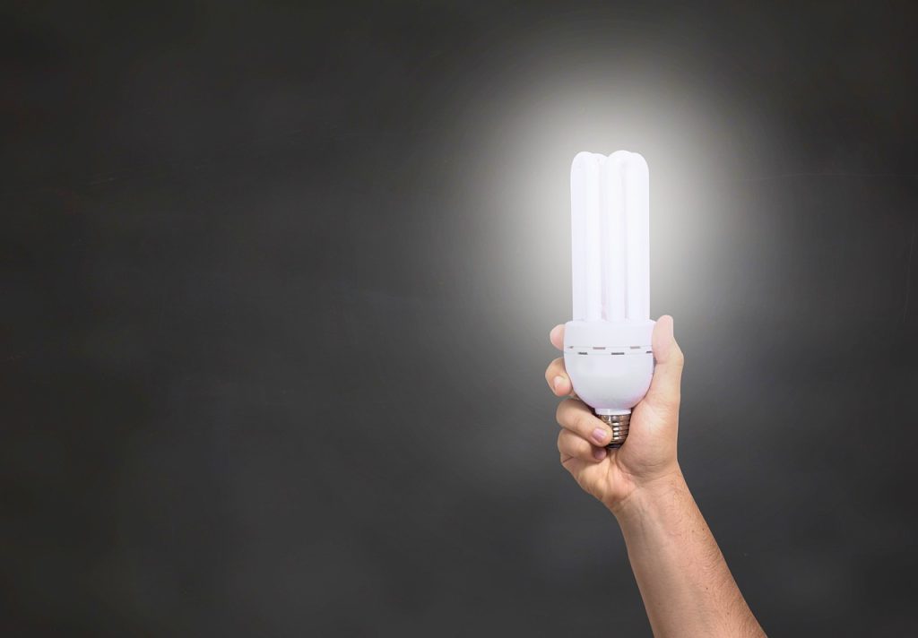 person holding a white light in their hand