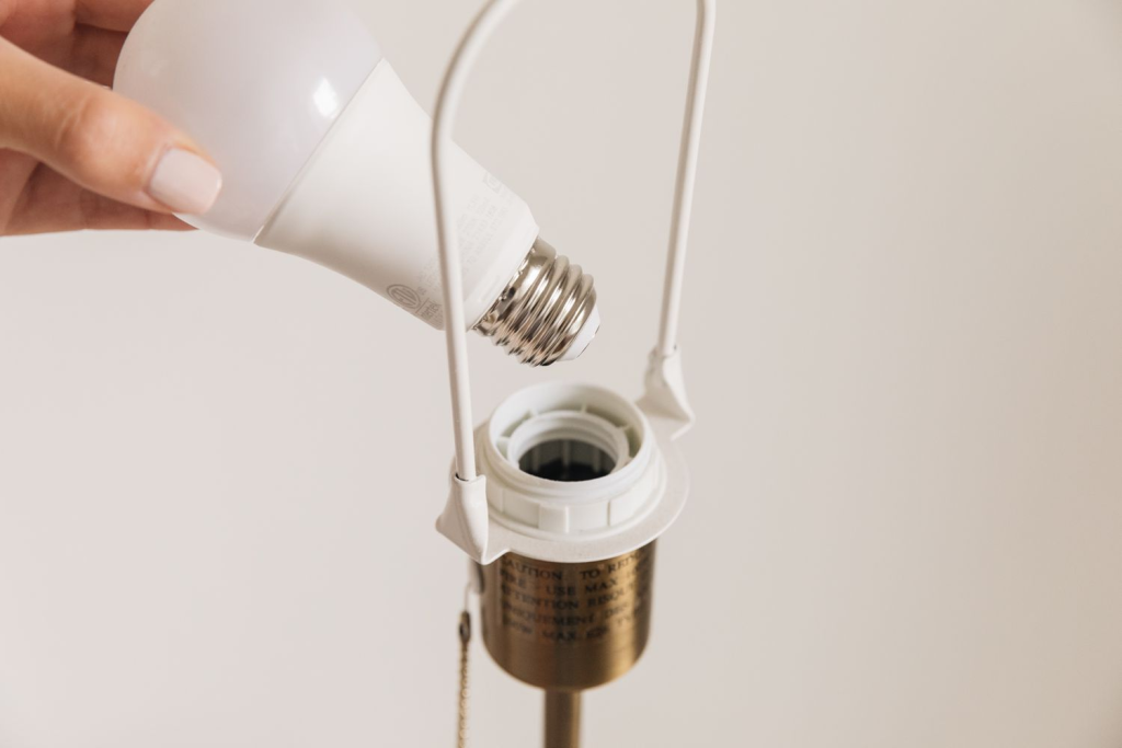 screwing in a light bulb