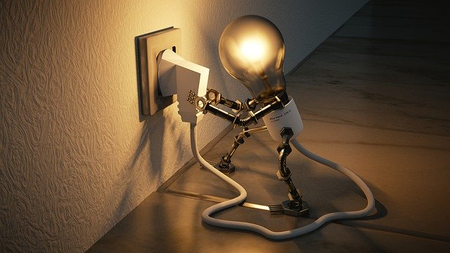 illuminated LED light bulb that is trying to plug out itself