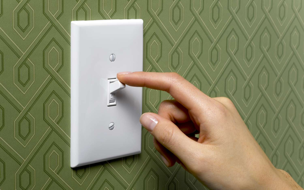 someone turning off the dimmer switch